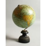 A SMALL TERRESTRIAL GLOBE, on turned wood stand. 20cms high.