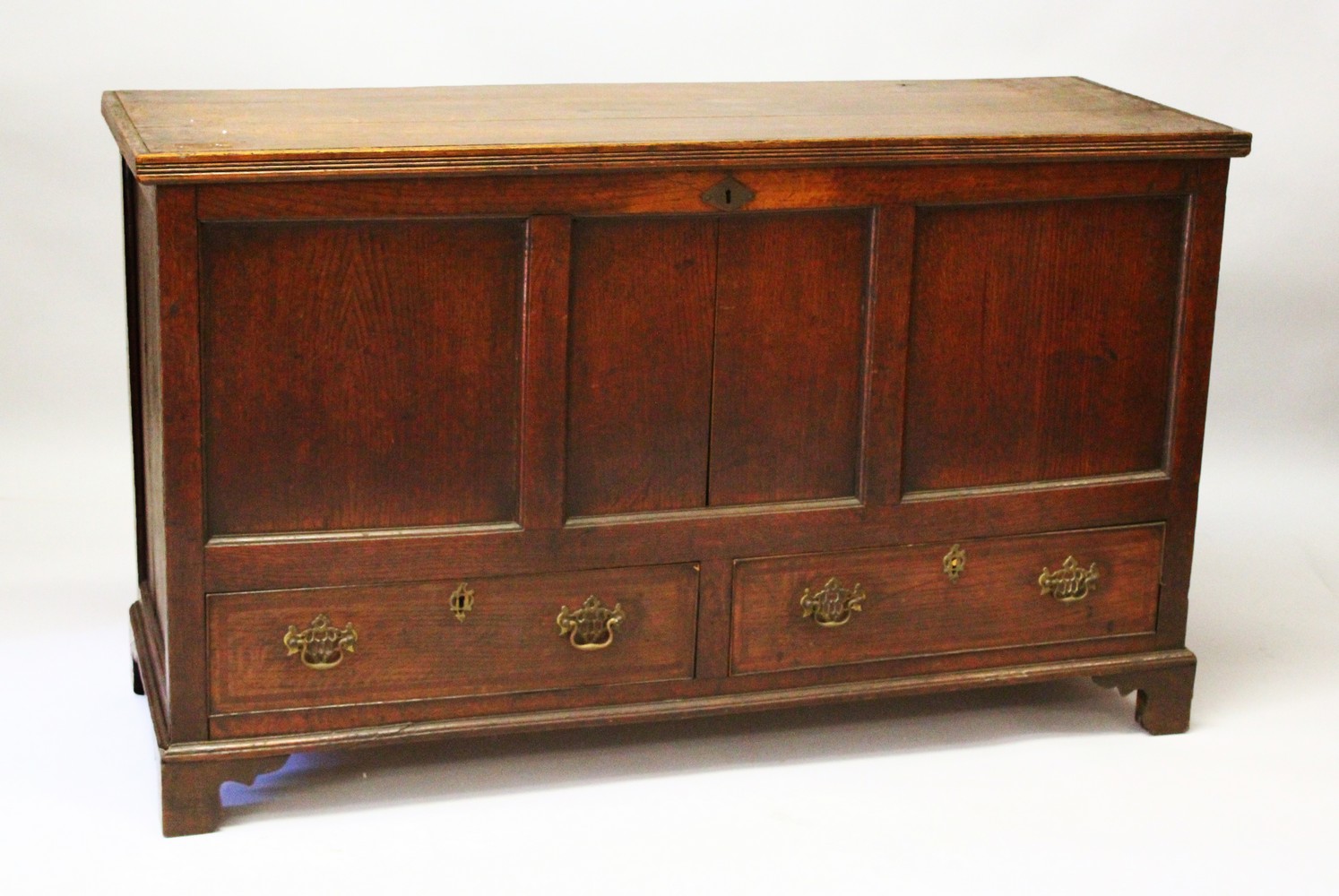 A 19TH CENTURY OAK COFFER BACK, with a plain plank top, triple panel front and two drawers, on