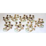 A SET OF EIGHT UNUSUAL FOUR-LIGHT WALL LIGHTS, naturalistic form, green painted and gilded
