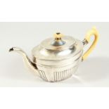 AN EARLY 19TH CENTURY RUSSIAN ST. PETERSBURG SEMI FLUTED OVAL TEAPOT with ivory handle and finial.