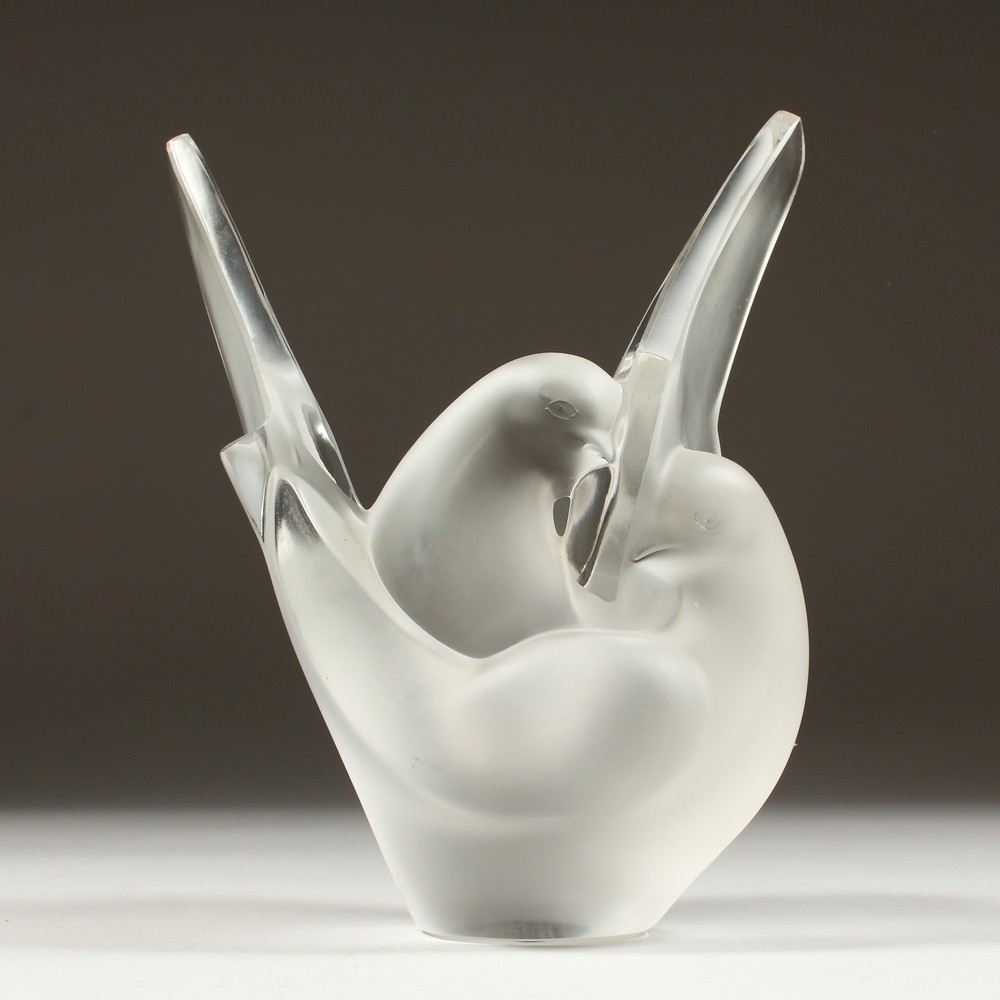 A LALIQUE FROSTED GLASS VASE "TWO ENTWINED DOVES". Etched R. Lalique, France. 8ins high.