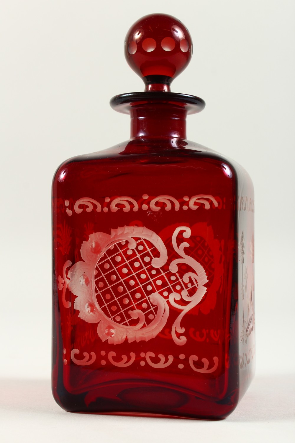 A BOHEMIAN SQUARE SHAPE RUBY GLASS DECANTER, engraved with a castle and a deer. 19cms high. - Image 5 of 9