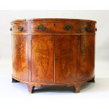 A GEORGE III DESIGN MAHOGANY BOWFRONT COMMODE, EARLY 20TH CENTURY, with quarter veneered top, oak