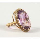 A 9CT GOLD AMETHYST RING.