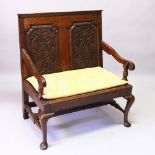 AN 18TH CENTURY AND LATER OAK SETTLE, with carved double panel back, down swept arms, solid seat, on