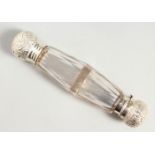 A VICTORIAN FACET CUT GLASS DOUBLE ENDED SCENT BOTTLE with lift off cap. with glass stopper, the