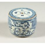 A BLUE AND WHITE BARREL SHAPE SCROLL WEIGHT. 9cms diameter.