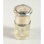 A CUT GLASS SCENT BOTTLE with stopper, the silver mount with lift up top , with a mirror. 6.5cms