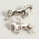 TWO SILVER PRANCING HORSE STICK PINS.