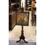 A VICTORIAN ROSEWOOD POLE SCREEN, the screen with a carved frame and embroidered panel depicting a