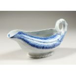 AN 18TH CENTURY WORCESTER BLUE AND WHITE COS LETTUCE SAUCEBOAT, CIRCA. 1755. 8.5ins long.