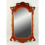 A GEORGIAN STYLE MAHOGANY FRETWORK FRAMED MIRROR, with carved and gilded decoration. 96cms high x