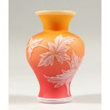 A GOOD THREE-COLOUR VASE, with leaves and flowers. 4.5ins high.