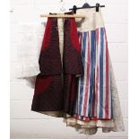 A COLLECTION OF FIVE VICTORIAN COTTON SKIRTS AND OVERSKIRTS including underskirt with fishtail.