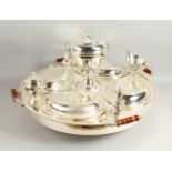 AN IMPRESSIVE LAZY SUSAN STYLE SERVING SET, the large circular stand fitted with four oval dishes