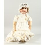 ARMAND MARSEILLE, A10M A BISQUE HEADED DOLL, with long hair and articulated body. 2ft 3ins long.