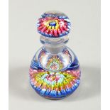 A MILLEFIORI GLASS PAPERWEIGHT INKWELL (rim chipped). 10cms high.