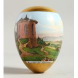 A SUPERB SMALL PORCELAIN EGG, painted with a continuous landscape scene. 3ins long.