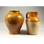 A LARGE ROYAL DOULTON VASE, with moulded leaf design; together with a stoneware jug. 36cms high