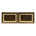 A PAIR OF 20TH CENTURY RELIEF CAST BRONZE PLAQUES, modelled as hunting dogs in landscapes, framed.