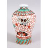 A 19TH / 20TH CENTURY CHINESE FAMILLE VERTE PORCELAIN MEPING VASE, decorated with butterflies upon a