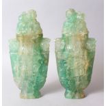 A GOOD PAIR OF CHINESE CARVED ROCK CRYSTAL LIDDED URNS, carved in archaic style