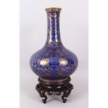 A FINE POWDER BLUE BOTTLE VASE, Imperial quality, the body strewn with gilt leaves and scrolls on
