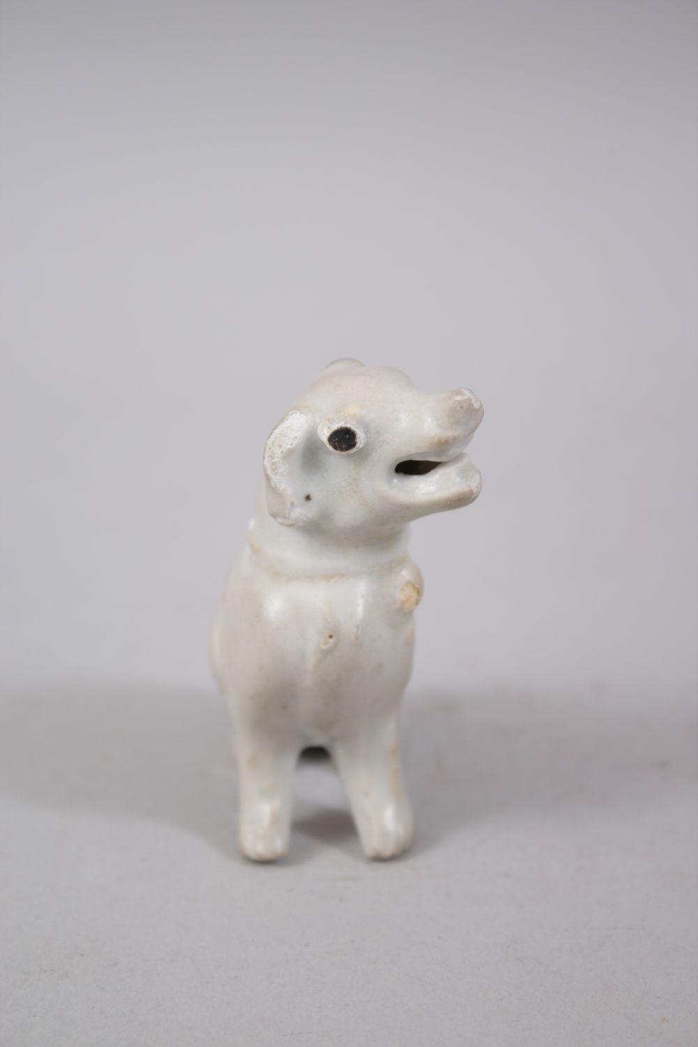 A CHINESE KANGXI BLANC DE CHINESE STYLE MODEL OF A HOUND, in a seated position with head to one - Image 2 of 4