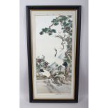 A CHINESE 20TH CENTURY FRAMED EMBROIDERED SILK / TEXTILE OF CRANES, the cranes stood amongst a river