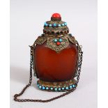 A 19TH / 20TH CENTURY CHINESE / SINO TIBETAN AMBER GLASS & PRECIOUS STONE SNUFF BOTTLE, the bottle