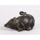 A CHINESE HAN DYNASTY BRONZE SCROLL WEIGHT IN THE FORM OF A RAT / RODENT, the rat in a low