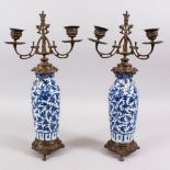A PAIR OF 19TH CENTURY CHINESE BLUE & WHITE PORCELAIN VASES / LAMPS, the body of the vased decorated