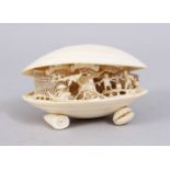 A GOOD 19TH CENTURY CHINESE CARVED IVORY CLAMS DREAM, the interior carved to depict native working