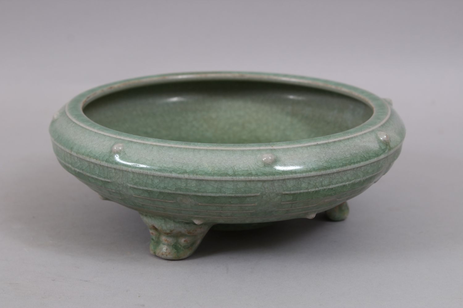 A GOOD CHINESE SONG STYLE PALE CELADON GROUND TRIPLE FOOT CENSOR, the body with moulded studs, the - Image 2 of 7