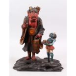 AN EDO / MEIJI PERIOD JAPANESE WOOD & LACQUERED OKIMONO OF ONI NO NENBUTSU, the figures stood upon a