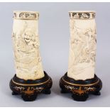 A GOOD PAIR OF JAPANESE MEIJI PERIOD CARVED IVORY TUSK VASES - SEVEN LUCKY GODS, the body of the