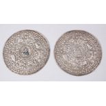 A PAIR OF 19TH CENTURY SINO TIBETAN SILVER PLAQUES FOR CEREMONY ROBES, the plaques with pressed