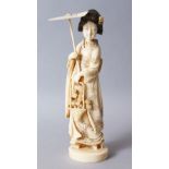 A GOOD JAPANESE MEIJI PERIOD CARVED IVORY OKIMONO OF A GEISHA GIRL, stood holding an umbrella and