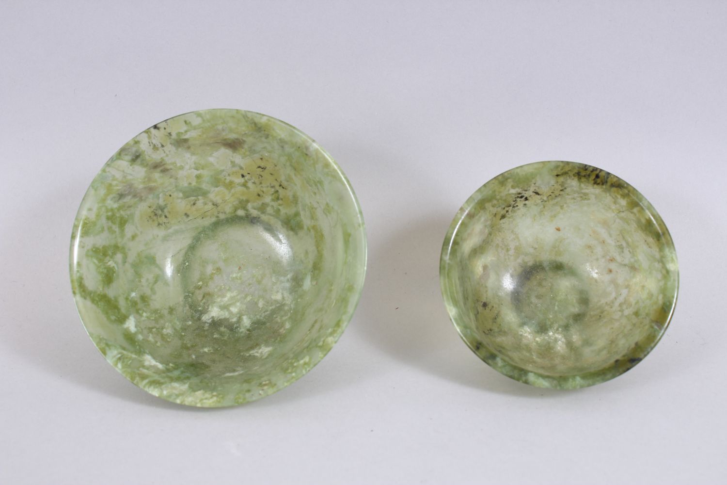 A GOOD PAIR OF 20TH CENTURY CHINESE GREEN JADE / HARDSTONE BOWLS, with accompanying carved stands, - Image 2 of 4