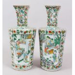 A PAIR OF 19TH CENTURY CHINESE CANTON FAMILLE ROSE PORCELAIN VASES, the body of the vases with