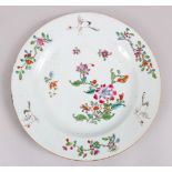 A GOOD 18TH CENTURY CHINESE FAMILLE ROSE PORCELAIN PLATE, decorated with scenes of cranes amongst