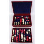 A 19TH / EARLY 20TH CENTURY CHINESE CARVED & STAINED IVORY CHESS SET IN LEATHER BOUND BOX, appears