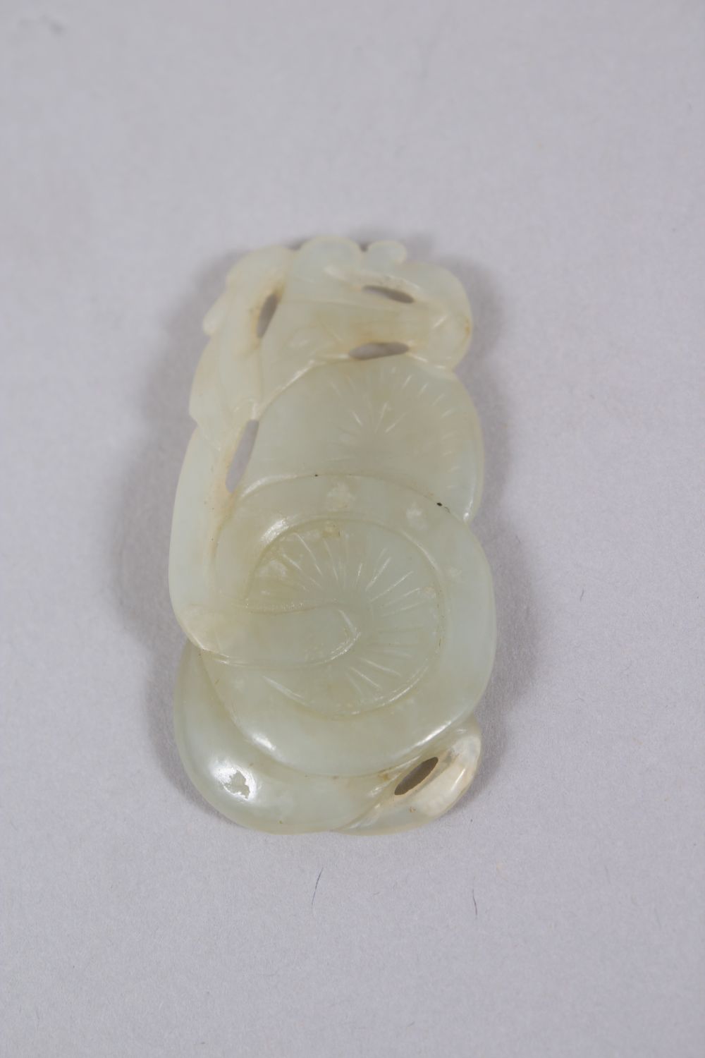 A GOOD 18TH / 19TH CENTURY CHINESE WHITE JADE PENDANT OF MUSHROOMS, 5.4cm wide X 2.5cm deep. - Image 2 of 2