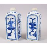 A GOOD PAIR OF CHINESE KANGXI BLUE & WHITE PORCELAIN TEA CADDIES, decorated with panels of flora and