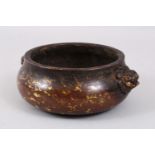 A GOOD HEAVY CHINESE BRONZE & GOLD SPLASH TWIN HANDLE CENSER, the handles formed from lion dog
