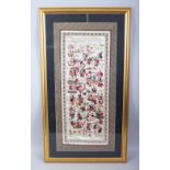 A LATE 19TH / EARLY 20TH CENTURY CHINESE EMBROIDERED SILK OF BOYS, the framed silk work depicting