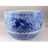 A GOOD JAPANESE MEIJI PERIOD BLUE & WHITE ARITA PORCELAIN JARDINIERE , decorated with scenes of