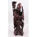 A GOOD LARGE 19TH CENTURY CHINESE CARVED HARDWOOD FIGURE OF SHOU LOU, he is stood holding his scroll