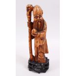 A GOOD 18TH CENTURY CHINESE BOXWOOD CARVED FIGURE OF SHOU LOU, stood bearing his staff and gourd