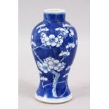 A 19TH CENTURY CHINESE BLUE & WHITE PORCELAIN PRUNUS VASE, the base with a four character kangxi